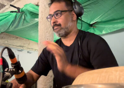 Drummer performing live with percussion instruments