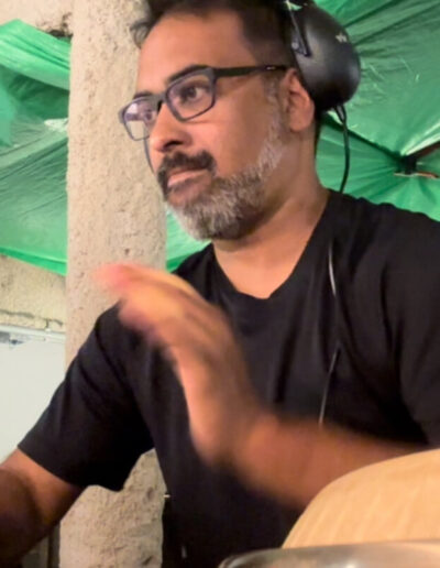 Drummer performing live with percussion instruments